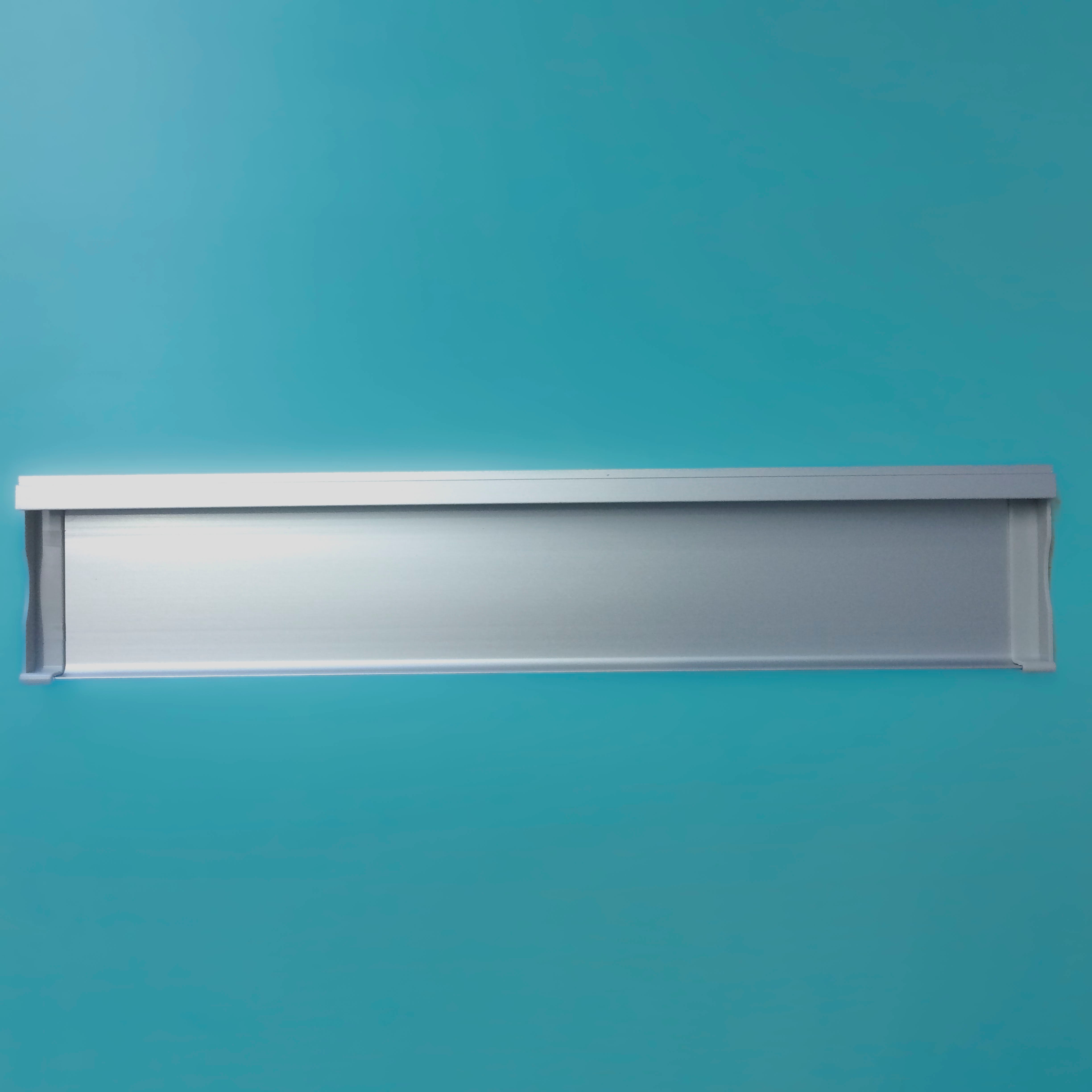 A rectangular silver metal Legamaster Shop Pen Tray for Economy Boards is centered on a solid light blue background, featuring raised edges.