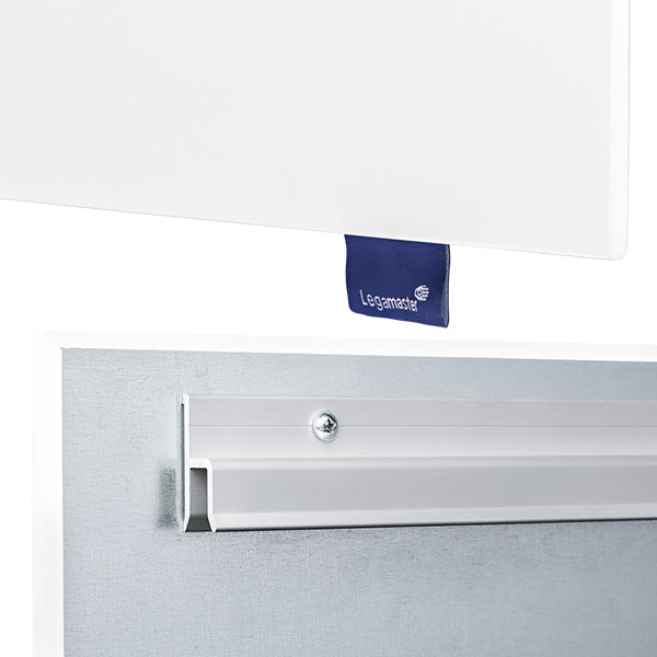 Close-up of a white board with a blue Legamaster fabric tag and a metal mounting bracket with a screw, showing how the board attaches to the wall.