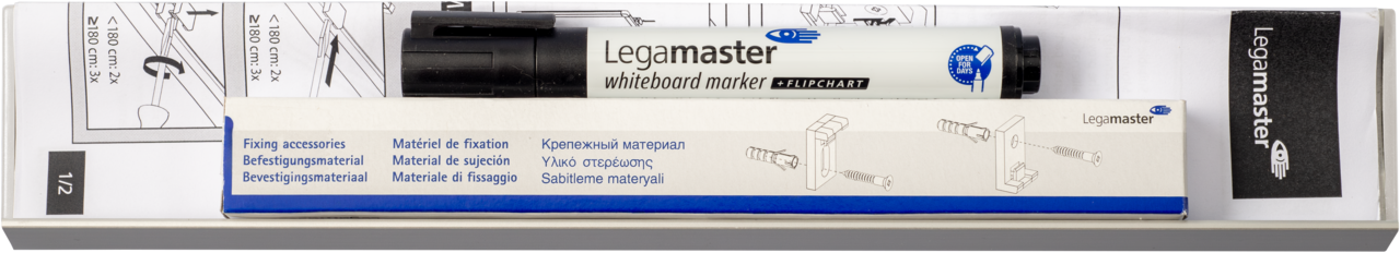 A Legamaster spare part set for board PREMIUM, including a whiteboard marker, fixing accessories, and multilingual instructions, is placed on a metal tray. The marker and accessory box have labels in several languages.